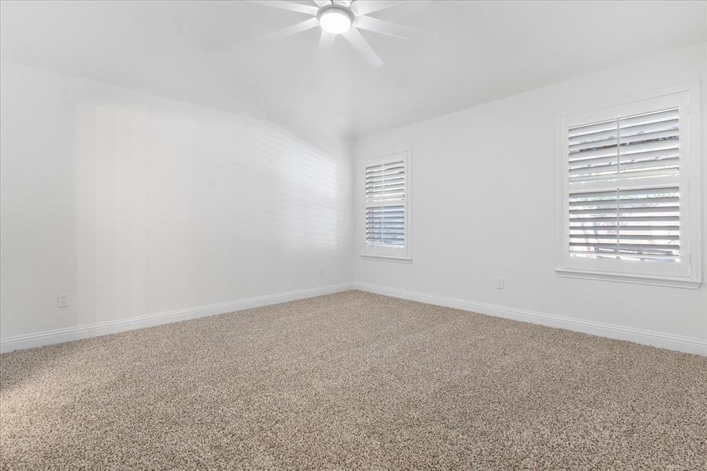 3701 Regency Circle Fort Worth, TX 76137 - Photo 12 of 31 an empty room with windows and fan