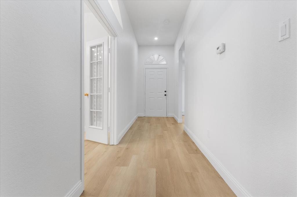 3701 Regency Circle Fort Worth, TX 76137 - Photo 19 of 31 a view of hallway with wooden floor