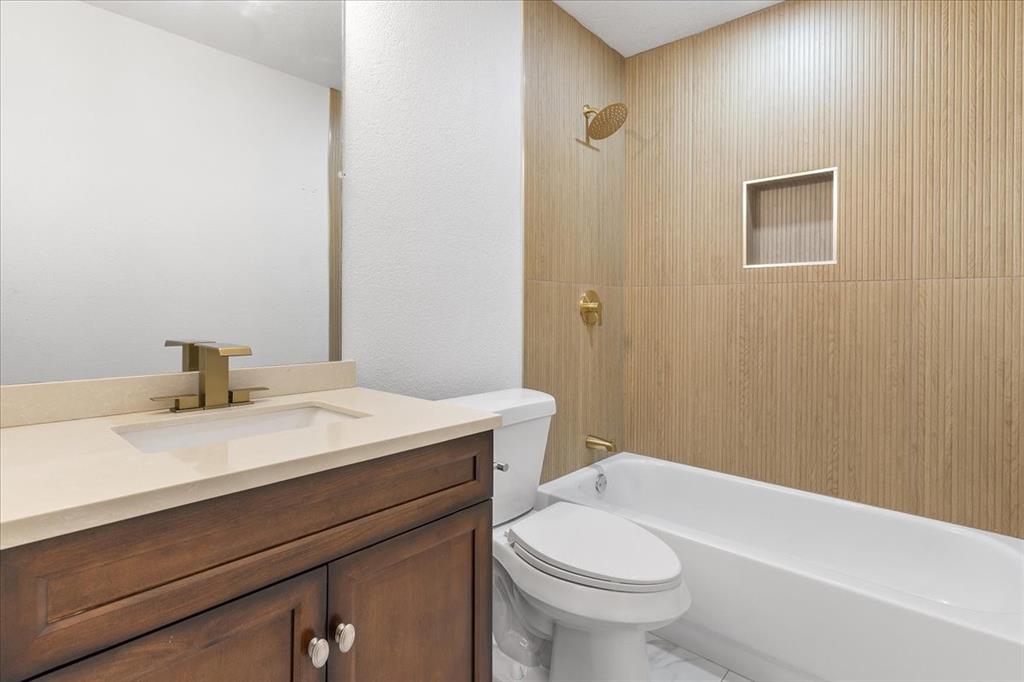3701 Regency Circle Fort Worth, TX 76137 - Photo 21 of 31 a bathroom with a sink a toilet and a bathtub
