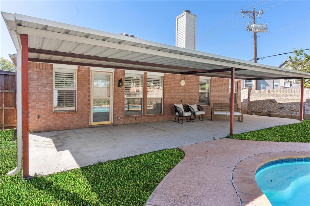 3701 Regency Circle Fort Worth, TX 76137 - Photo 27 of 31 a view of a patio with table and chairs