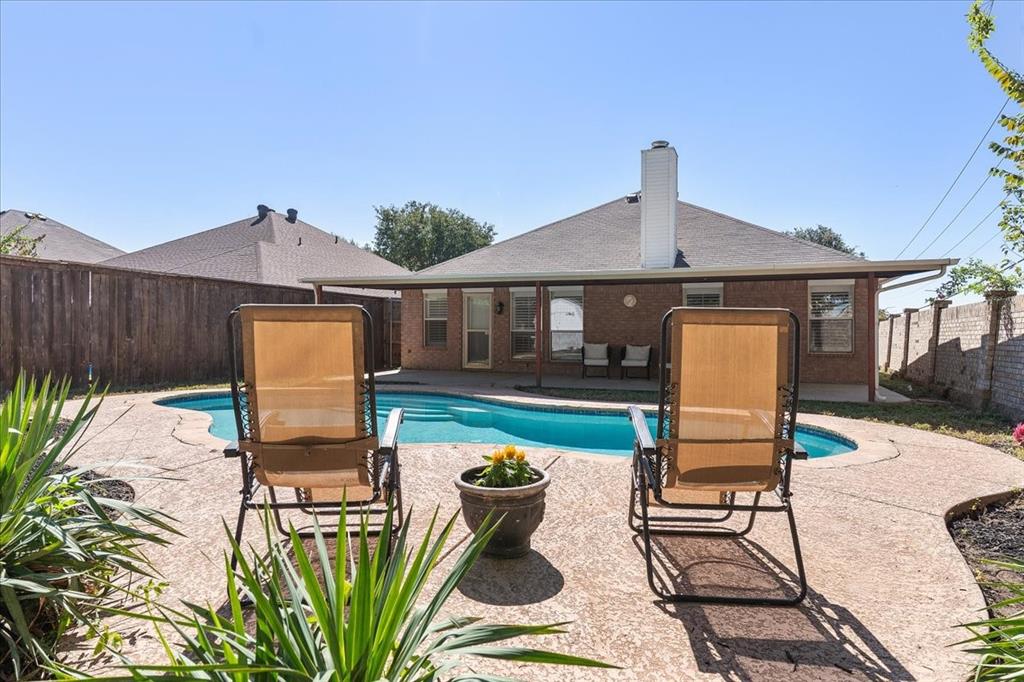 3701 Regency Circle Fort Worth, TX 76137 - Photo 29 of 31 a patio with a table and chairs