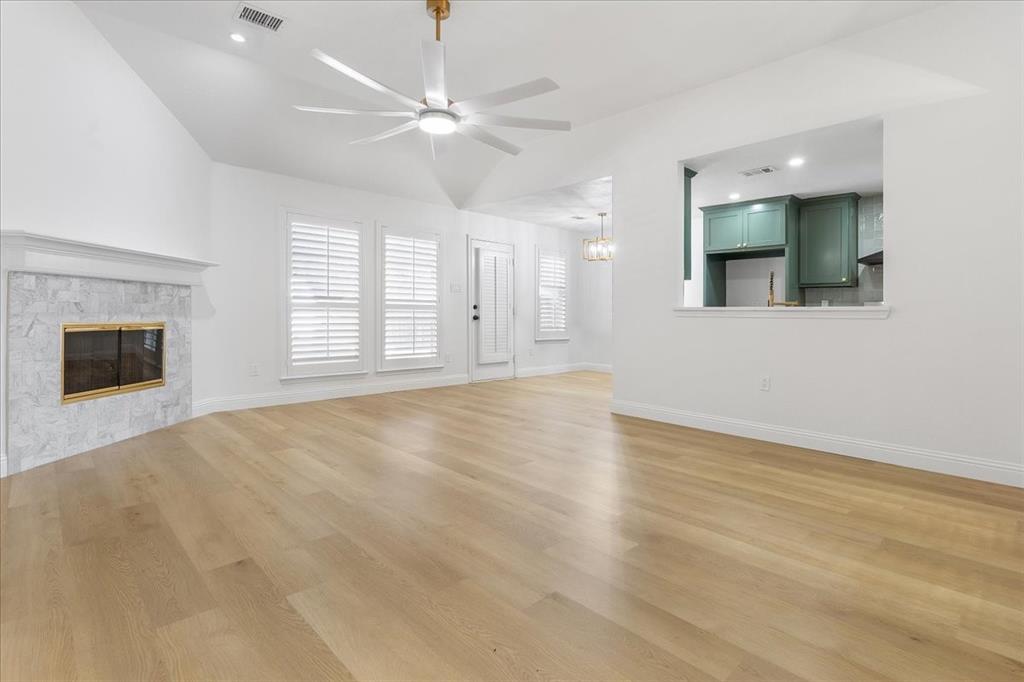 3701 Regency Circle Fort Worth, TX 76137 - Photo 7 of 31 an empty room with windows and fireplace