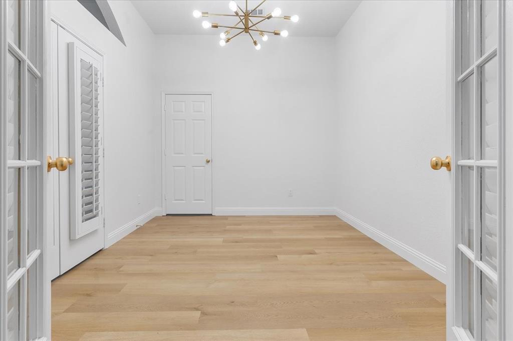 3701 Regency Circle Fort Worth, TX 76137 - Photo 9 of 31 a view of a room with wooden floor and fan