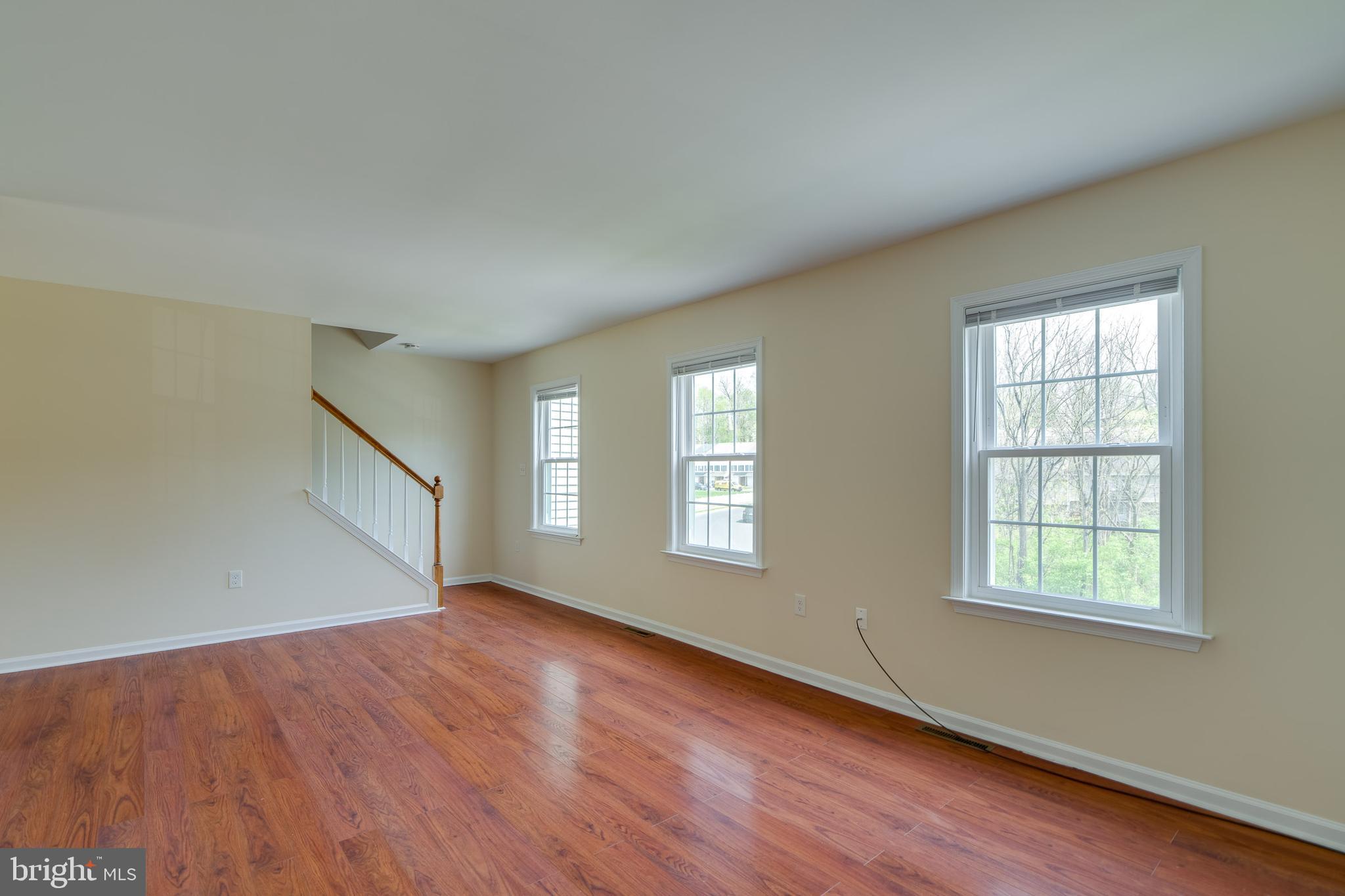 25 Tupelo Street Lititz, PA 17543 - Photo 11 of 20 an empty room with wooden floor and windows