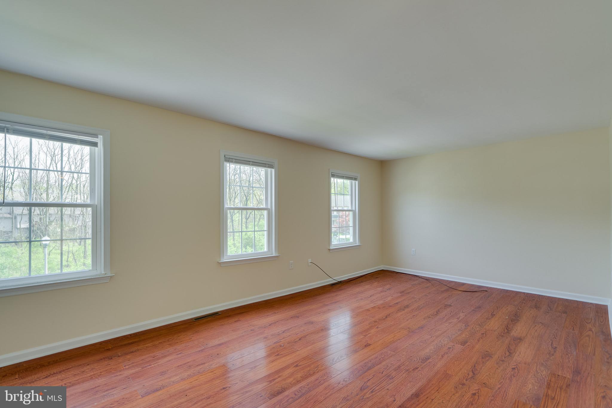 25 Tupelo Street Lititz, PA 17543 - Photo 12 of 20 an empty room with wooden floor and windows