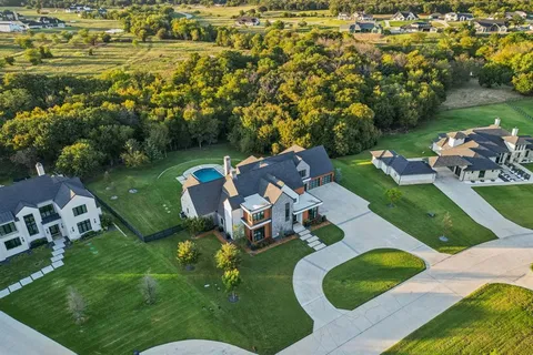 an aerial view of a house with outdoor space