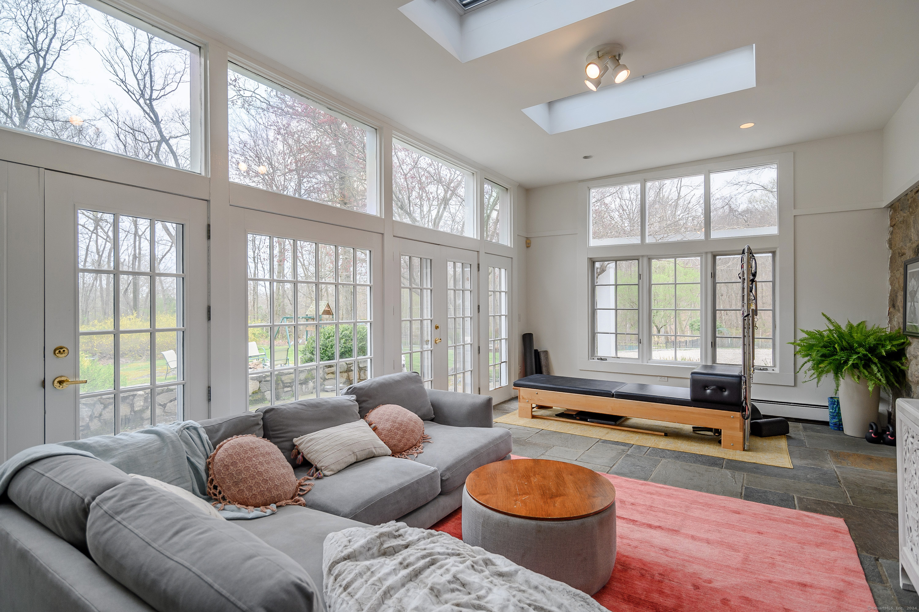58 Woodchuck Lane Ridgefield, CT 06877 - Photo 15 of 38 a living room with furniture and a large window