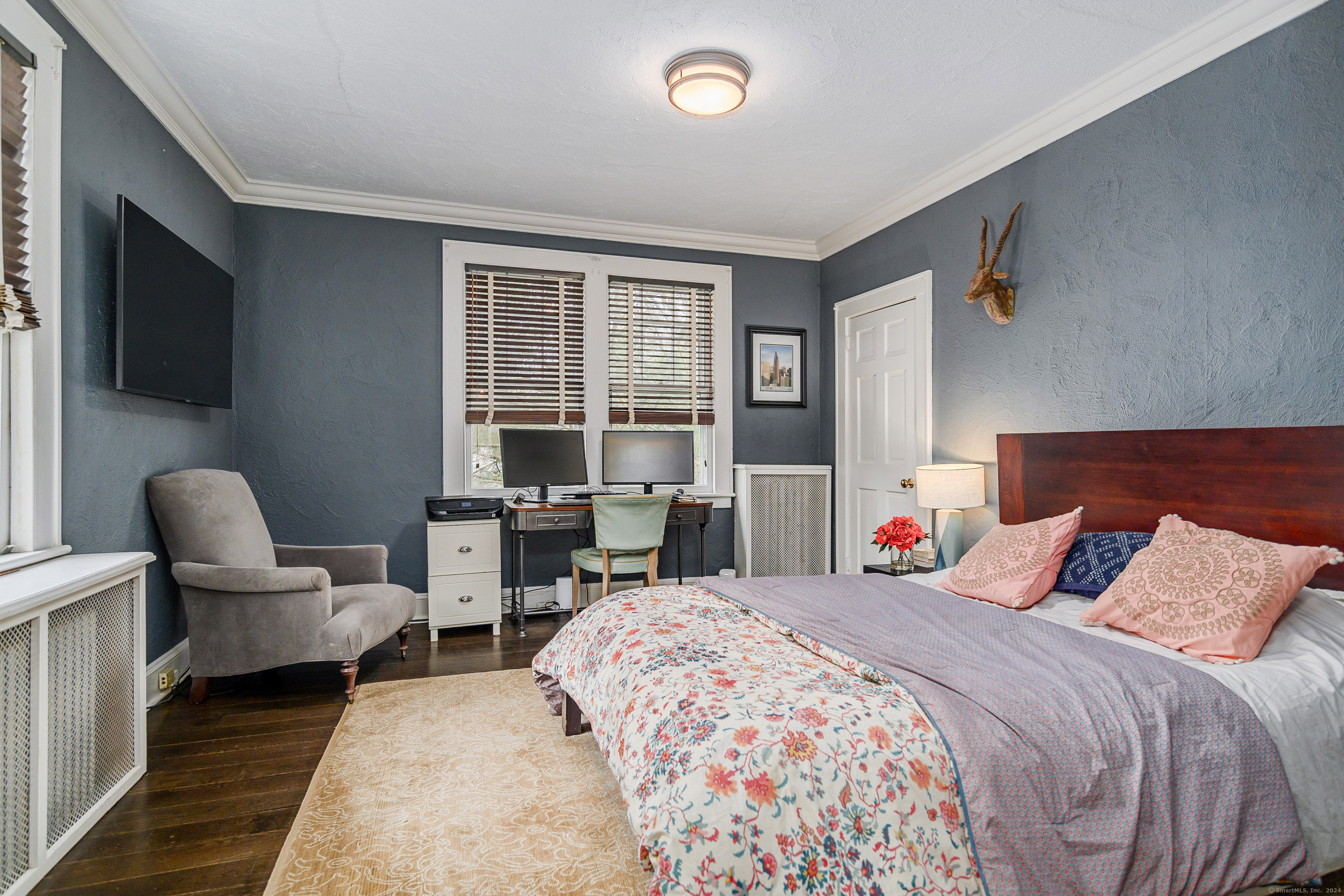 58 Woodchuck Lane Ridgefield, CT 06877 - Photo 23 of 38 a bedroom with a bed and glass door
