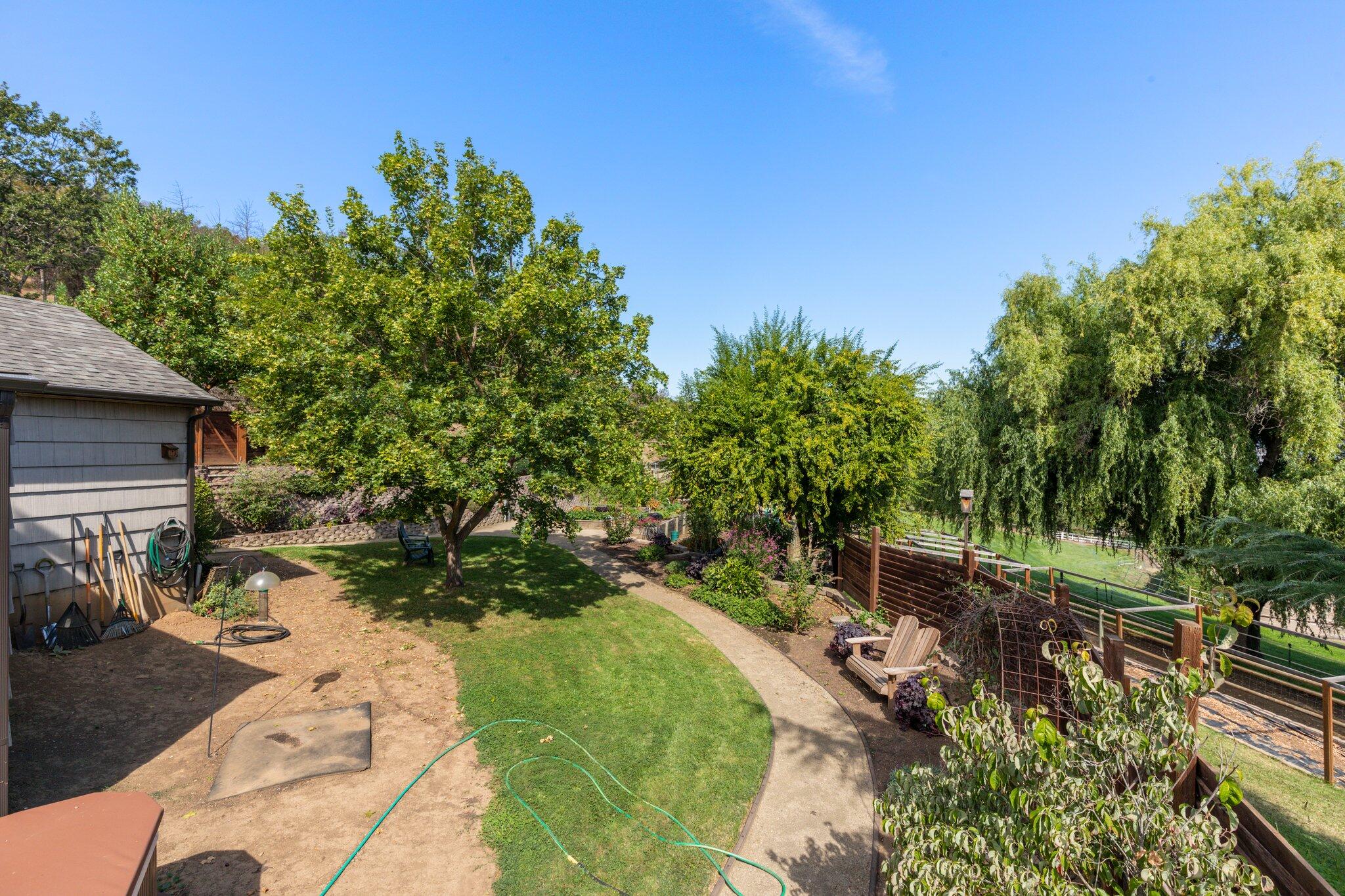 6062 Adams Road Talent, OR 97540 - Photo 32 of 75 a view of backyard with outdoor seating and green space