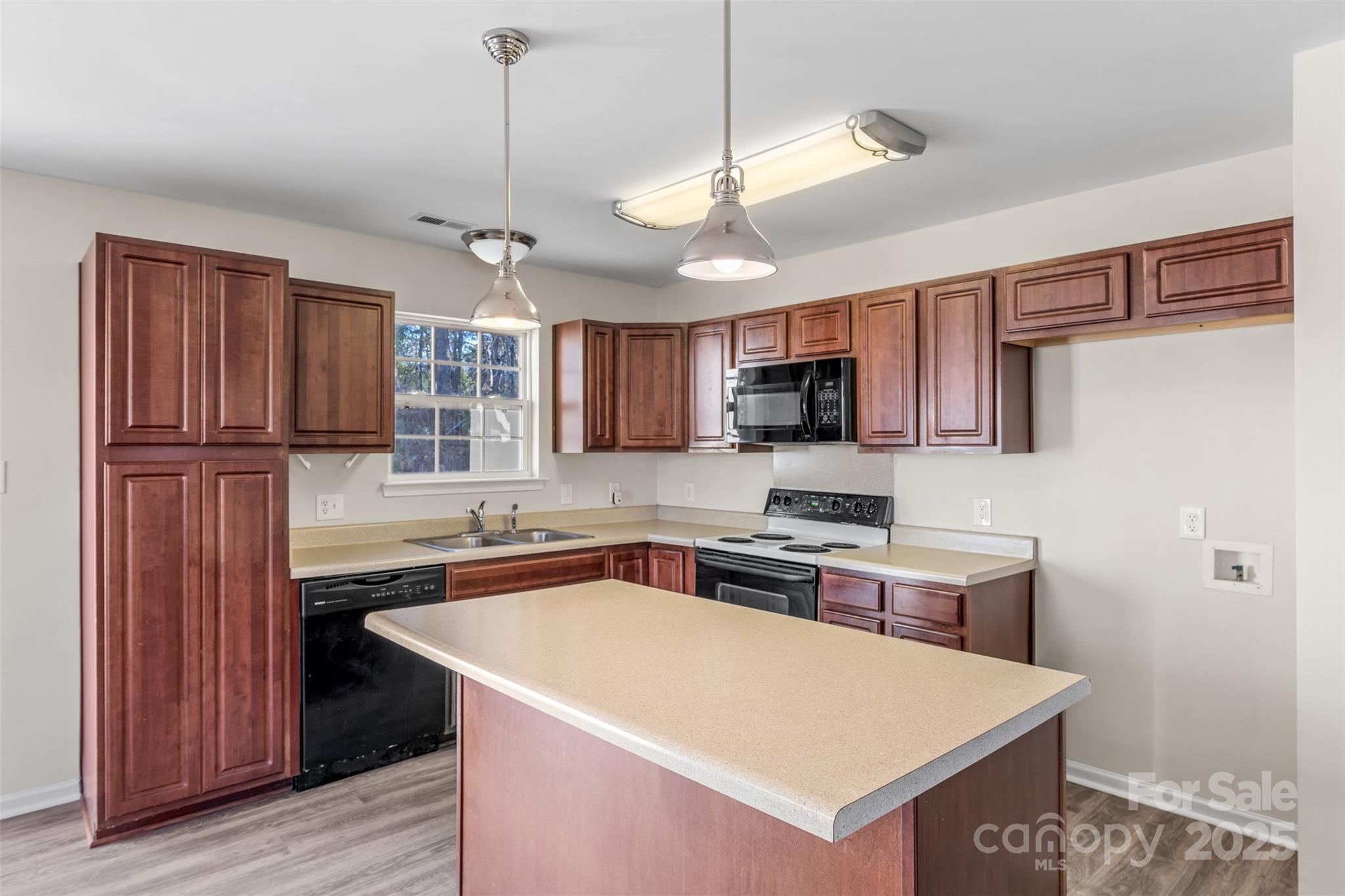 3065 Georgetown Road Lancaster, SC 29720 - Photo 15 of 26 a kitchen with stainless steel appliances granite countertop a sink stove and refrigerator