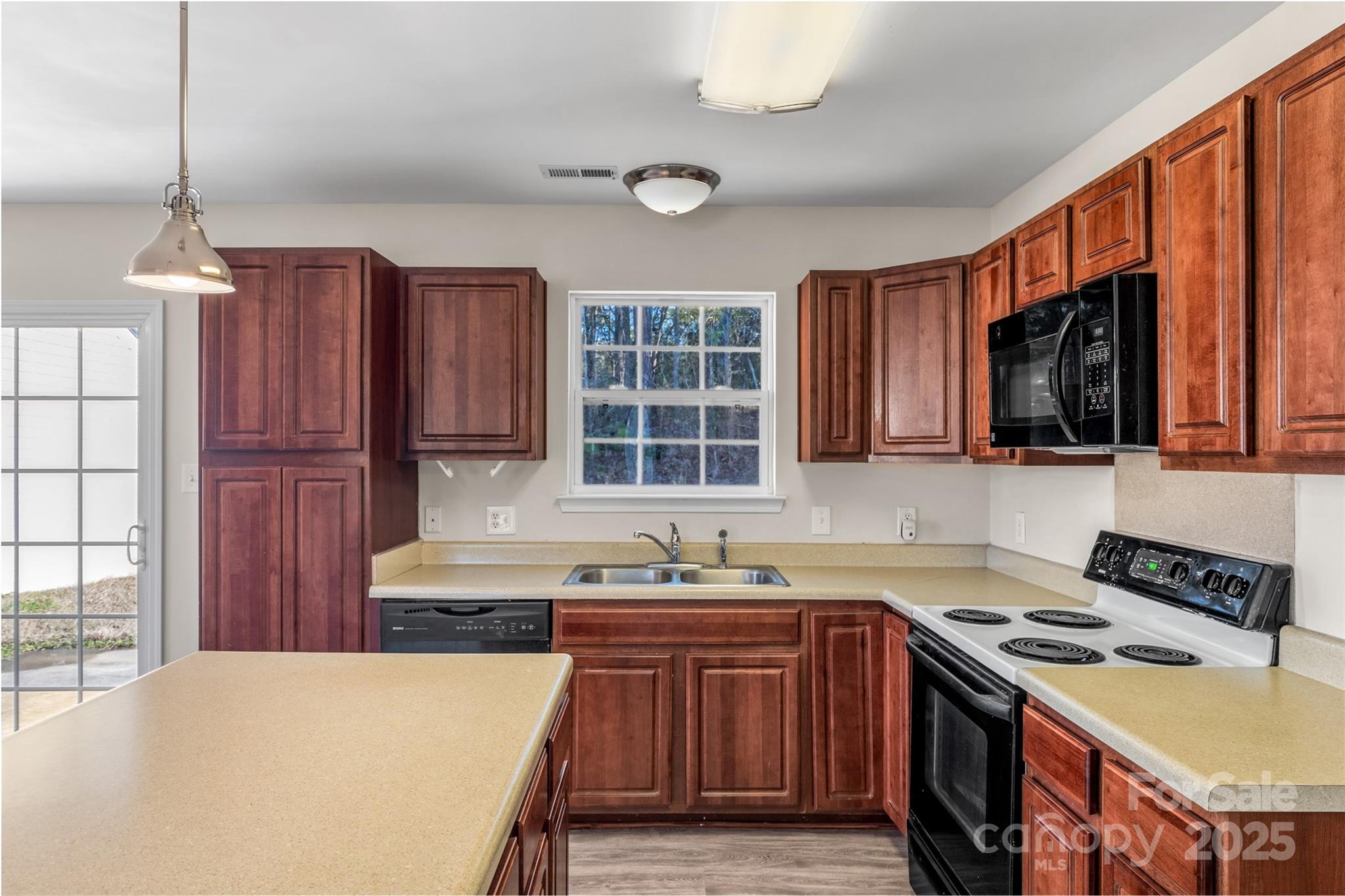 3065 Georgetown Road Lancaster, SC 29720 - Photo 16 of 26 a kitchen with stainless steel appliances granite countertop a stove a sink dishwasher and a microwave oven with cabinets