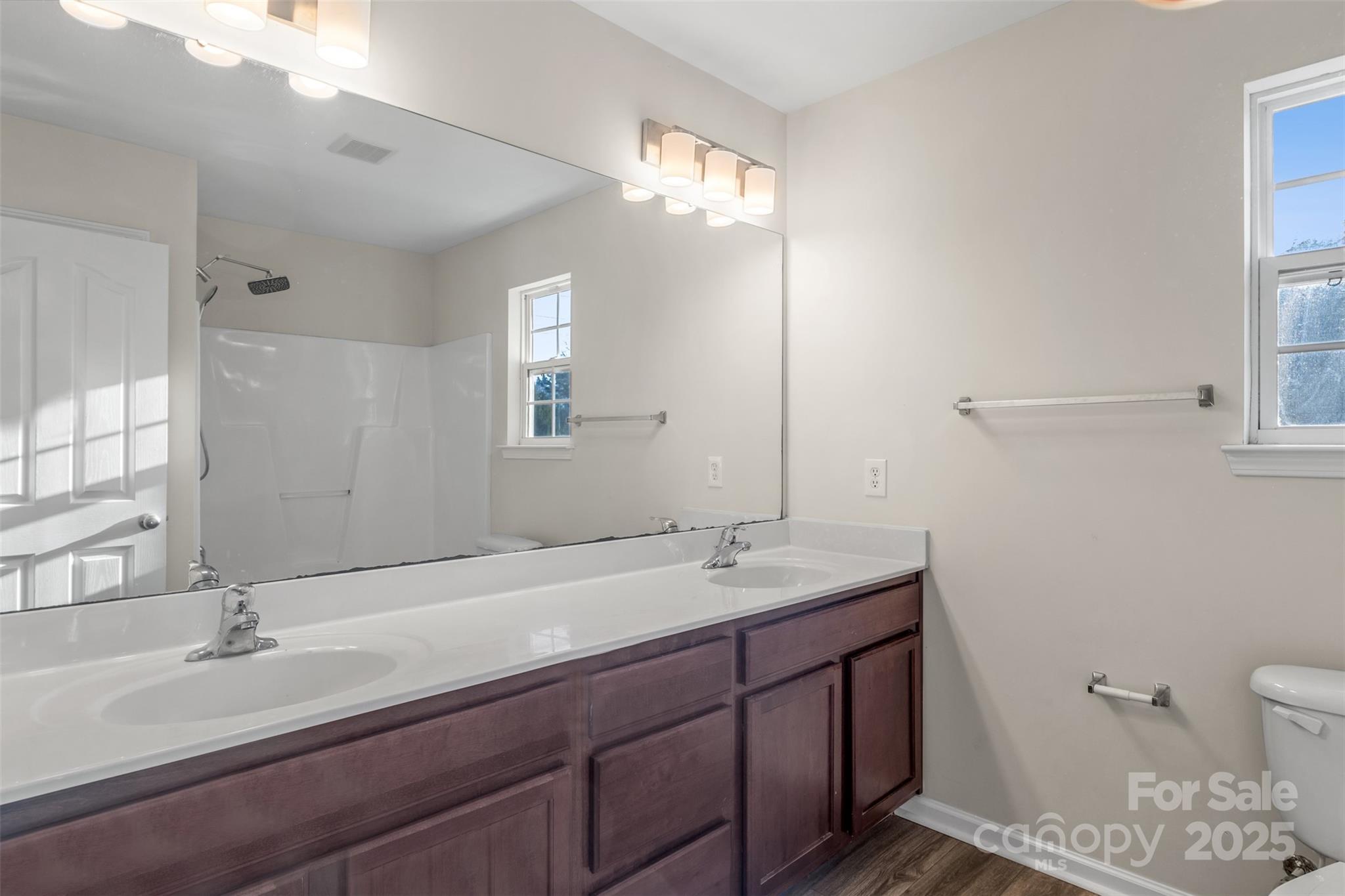 3065 Georgetown Road Lancaster, SC 29720 - Photo 21 of 26 a bathroom with a double vanity sink and a mirror