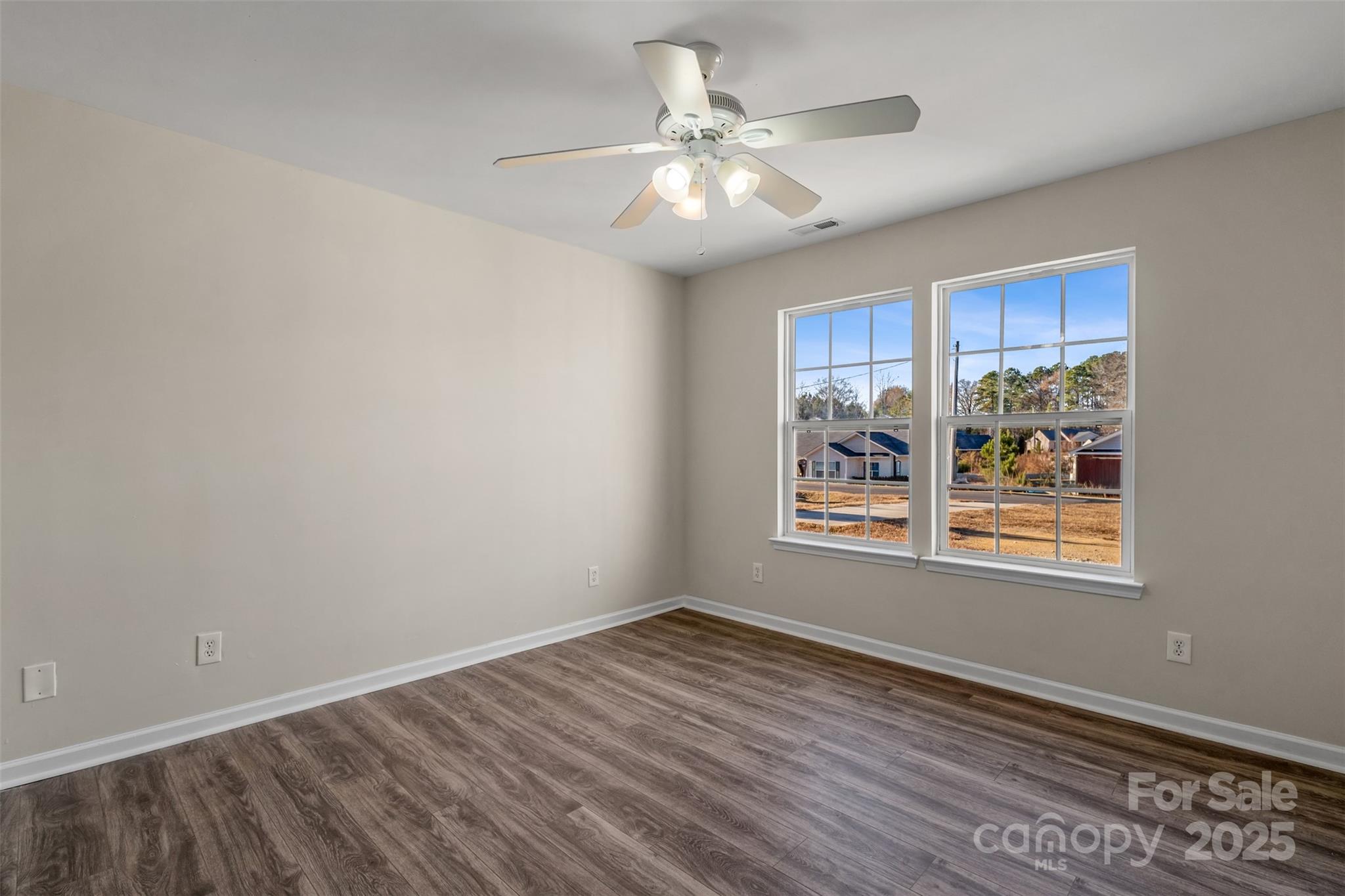 3065 Georgetown Road Lancaster, SC 29720 - Photo 24 of 26 a view of an empty room with wooden floor and a window
