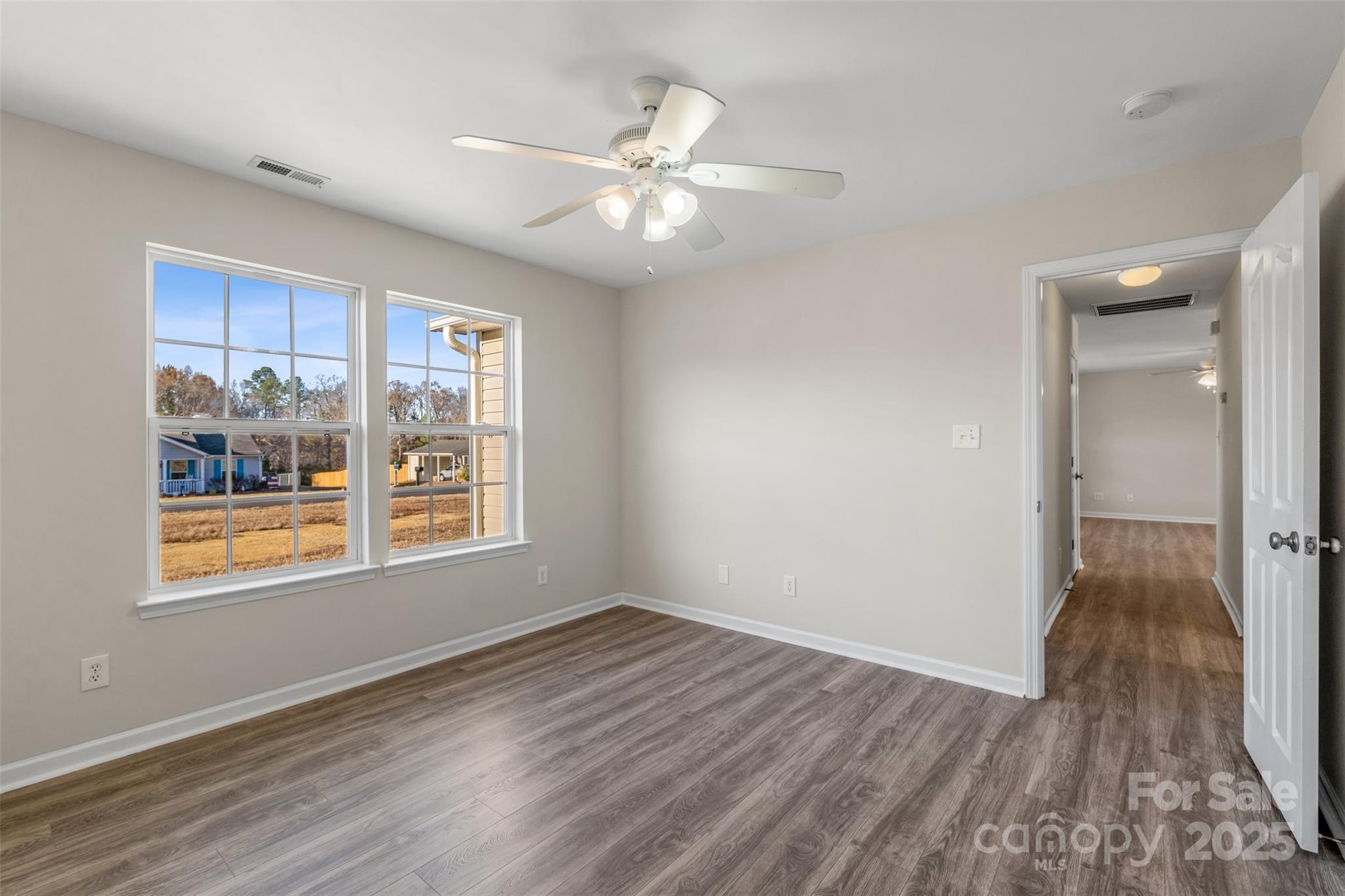3065 Georgetown Road Lancaster, SC 29720 - Photo 25 of 26 a view of an empty room with wooden floor and a window