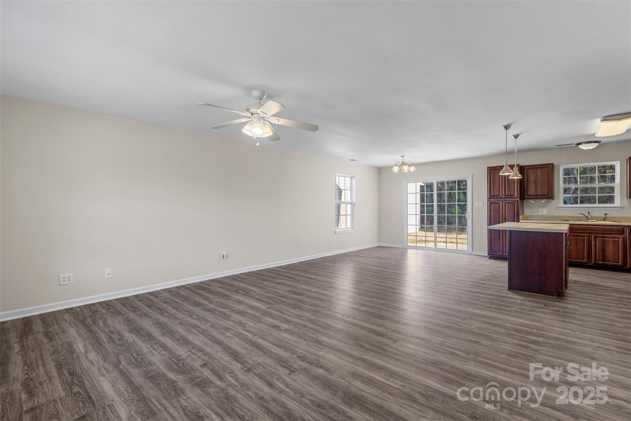 3065 Georgetown Road Lancaster, SC 29720 - Photo 9 of 26 a view of an empty room with window and wooden floor