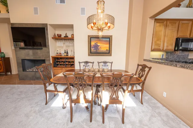 a dining room with furniture and window