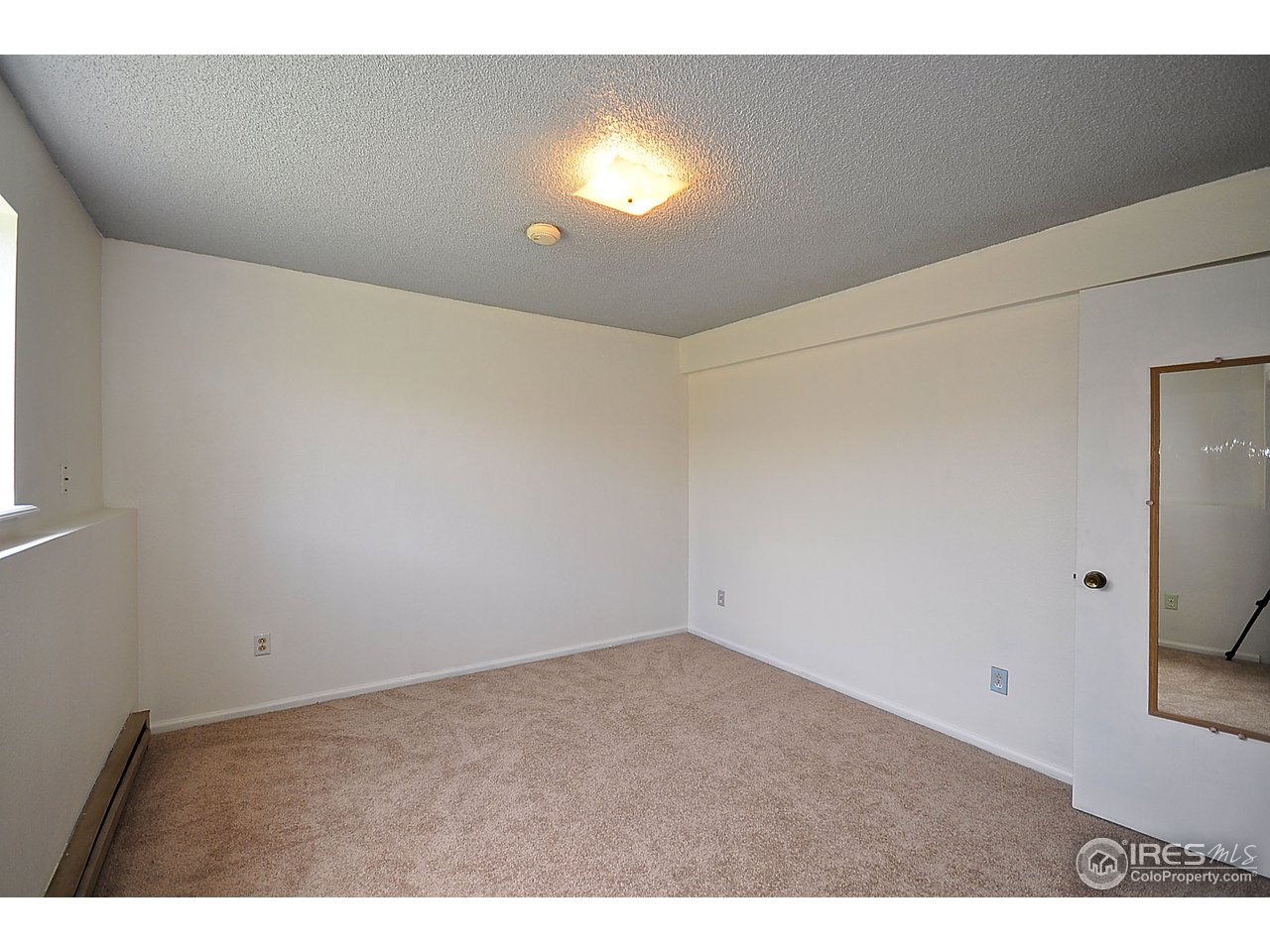 2628 Redwing Road, Unit 2A Fort Collins, CO 80526 - Photo 13 of 16 a view of an empty room