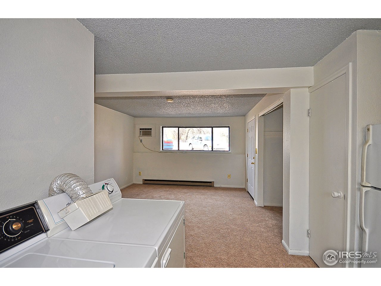 2628 Redwing Road, Unit 2A Fort Collins, CO 80526 - Photo 5 of 16 a view of an empty room and a window