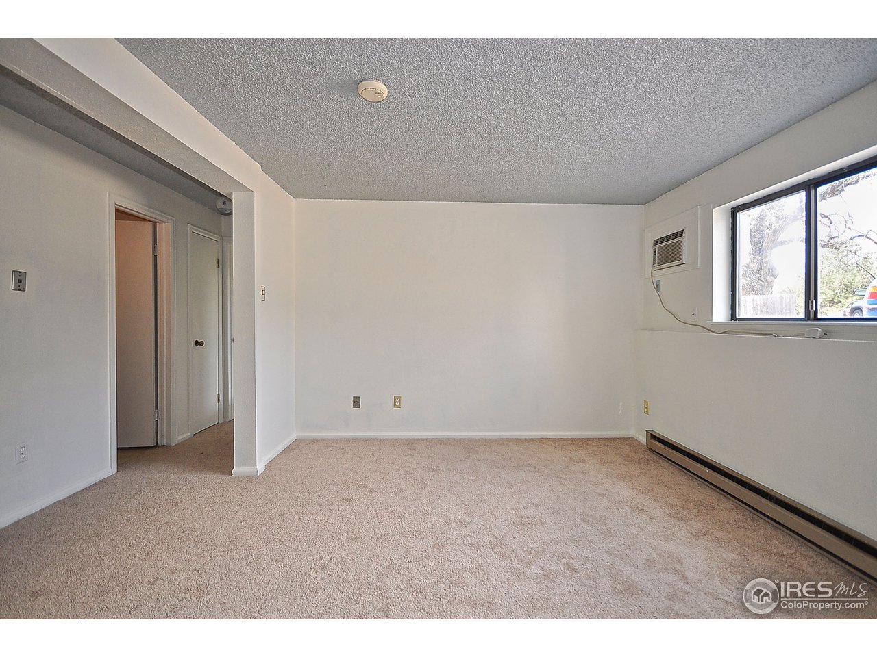 2628 Redwing Road, Unit 2A Fort Collins, CO 80526 - Photo 7 of 16 a view of an empty room with a window