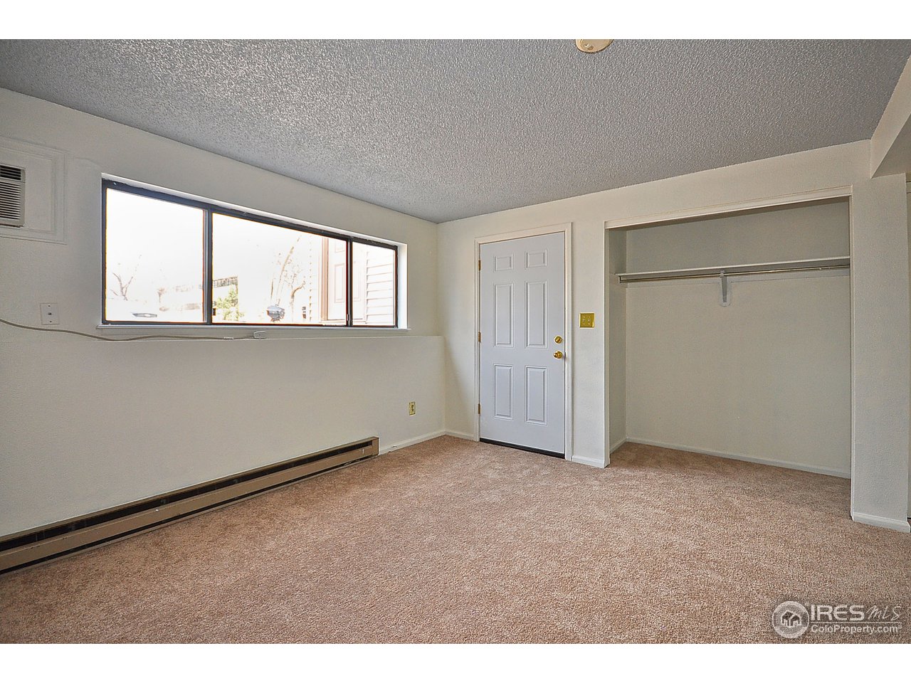 2628 Redwing Road, Unit 2A Fort Collins, CO 80526 - Photo 8 of 16 an empty room with windows