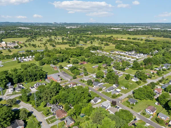 a aerial view of a house with a yard