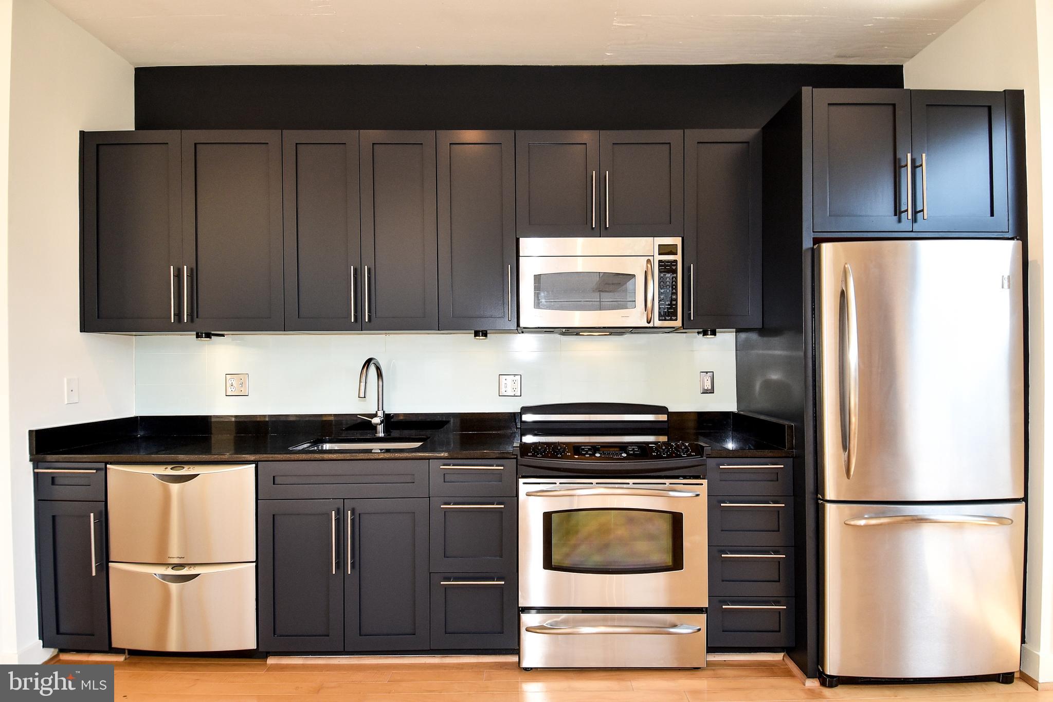 2125 14th Street Northwest, Unit 214 Washington, DC 20009 - Photo 13 of 28 Dark Cabinets & Stainless Steel appliances
