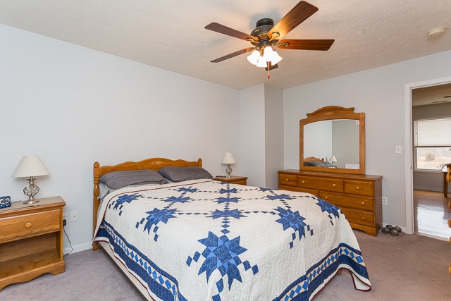 2001 Spitzer Road Broadway, VA 22815 - Photo 14 of 38 a bedroom with a bed and a chandelier