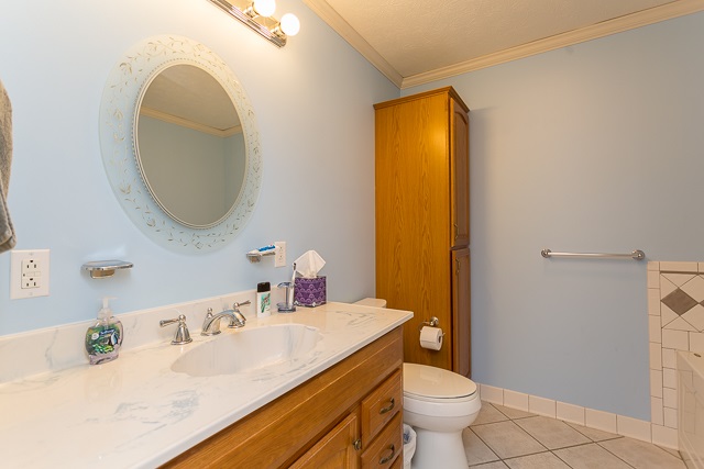 2001 Spitzer Road Broadway, VA 22815 - Photo 15 of 38 a bathroom with a granite countertop sink and a mirror