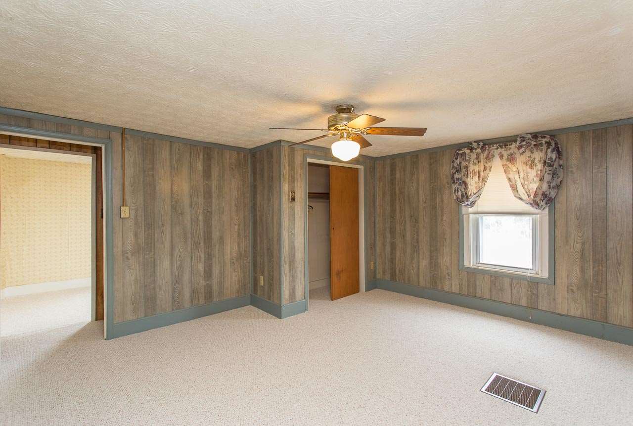 2001 Spitzer Road Broadway, VA 22815 - Photo 24 of 38 an empty room with windows and chandelier fan