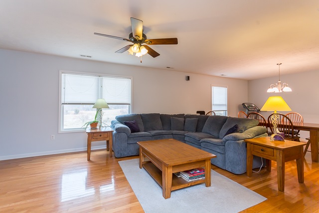 2001 Spitzer Road Broadway, VA 22815 - Photo 3 of 38 a living room with furniture a chandelier and a window