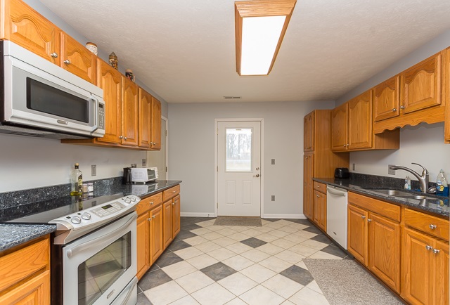 2001 Spitzer Road Broadway, VA 22815 - Photo 7 of 38 a kitchen with stainless steel appliances granite countertop a sink and cabinets