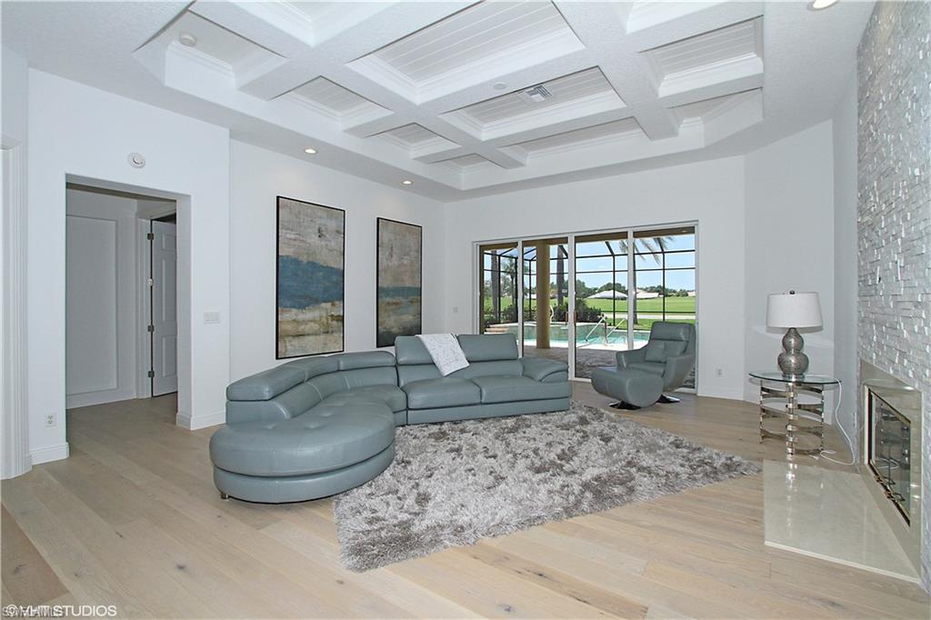 464 Terracina Way Naples, FL 34119 - Photo 1 of 35 Warm, rich wood floors throughout the house-except for the guest bedrooms.