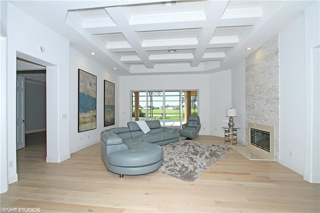 464 Terracina Way Naples, FL 34119 - Photo 7 of 35 Custom coffered ceiling and detailed tiled fireplace!