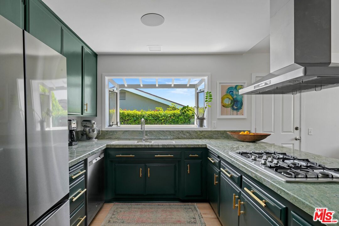 3516 Shoreheights Drive Malibu, CA 90265 - Photo 12 of 29 a kitchen with stainless steel appliances granite countertop a stove and a refrigerator