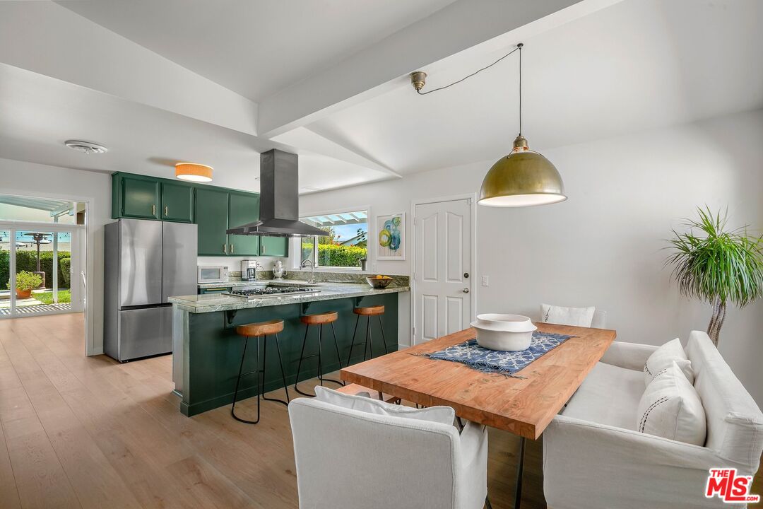 3516 Shoreheights Drive Malibu, CA 90265 - Photo 14 of 29 a kitchen with stainless steel appliances kitchen island a refrigerator and a sink