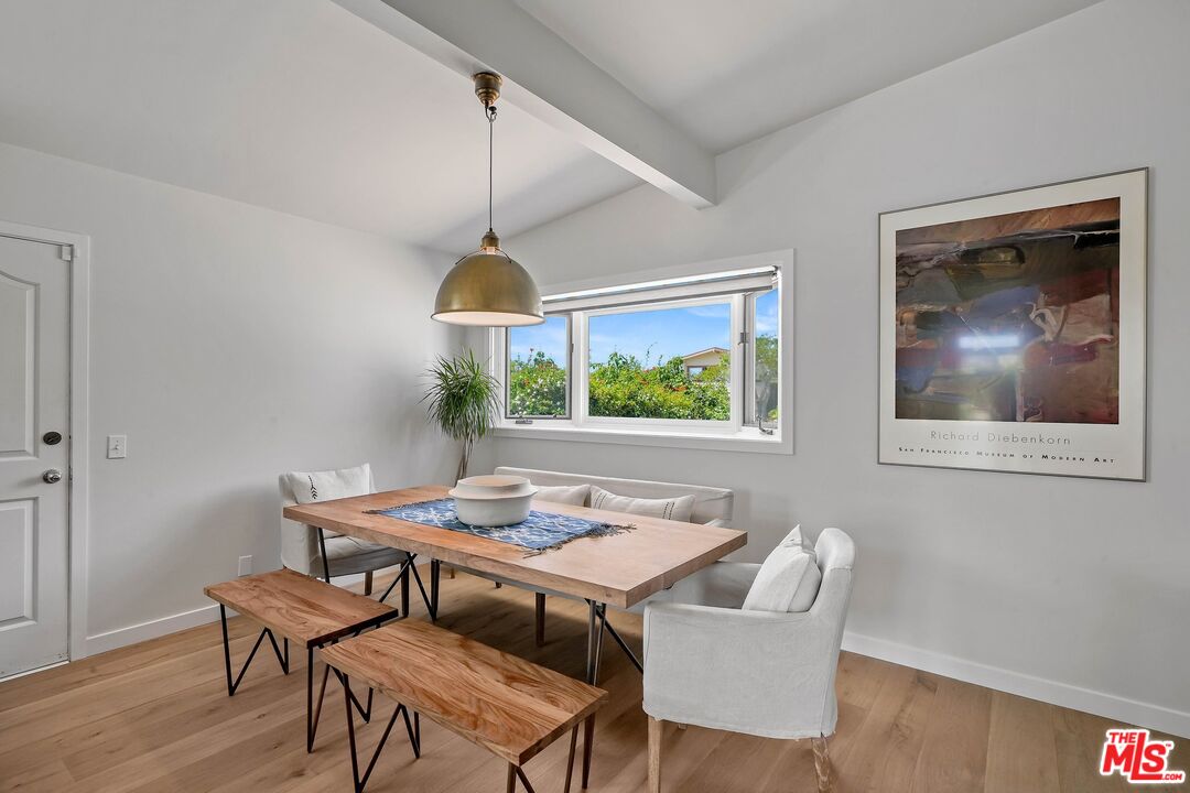 3516 Shoreheights Drive Malibu, CA 90265 - Photo 15 of 29 a view of a dining room with furniture window and wooden floor