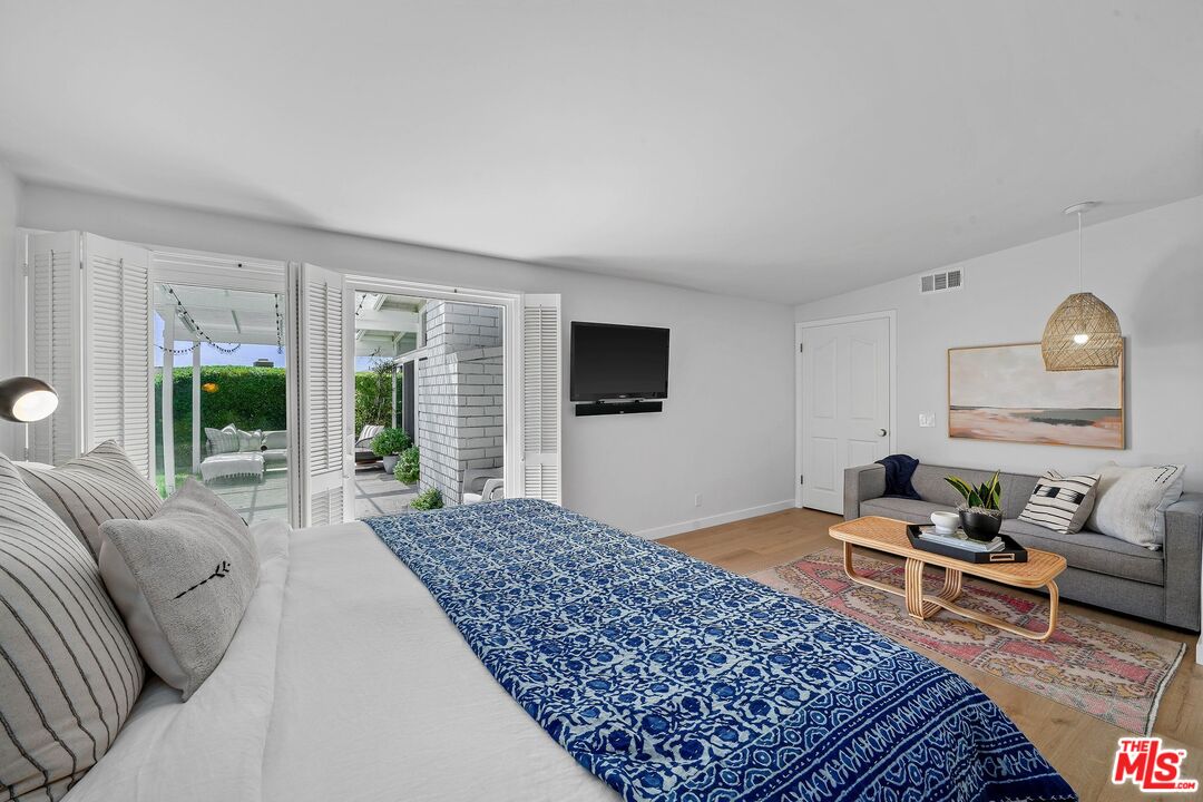 3516 Shoreheights Drive Malibu, CA 90265 - Photo 17 of 29 a living room with furniture and a flat screen tv
