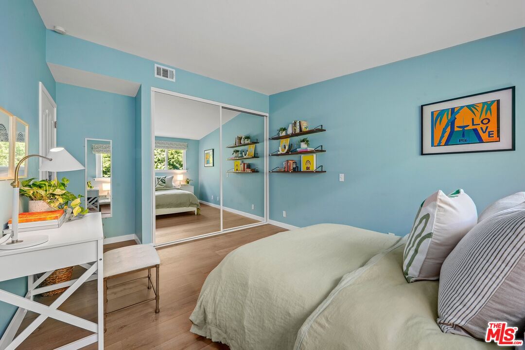 3516 Shoreheights Drive Malibu, CA 90265 - Photo 21 of 29 a bedroom with a bed and dresser