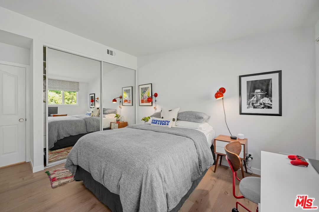 3516 Shoreheights Drive Malibu, CA 90265 - Photo 22 of 29 a bed room with a bed and a couch