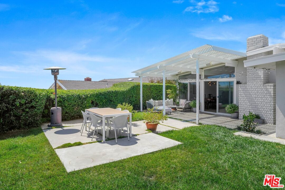 3516 Shoreheights Drive Malibu, CA 90265 - Photo 25 of 29 a view of a house with backyard sitting area and garden