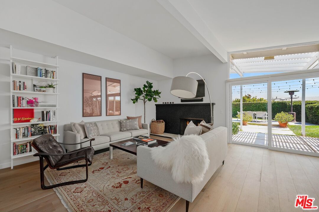 3516 Shoreheights Drive Malibu, CA 90265 - Photo 6 of 29 a living room with furniture and a fireplace