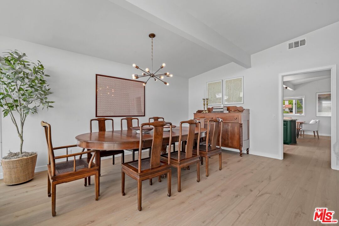 3516 Shoreheights Drive Malibu, CA 90265 - Photo 9 of 29 a view of a dining room with furniture and chandelier