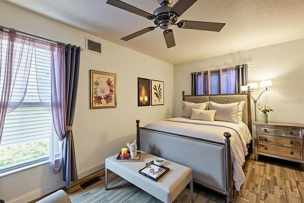 11327 Grove Street Leesburg, FL 34788 - Photo 19 of 40 a bedroom with a bed furniture and a window