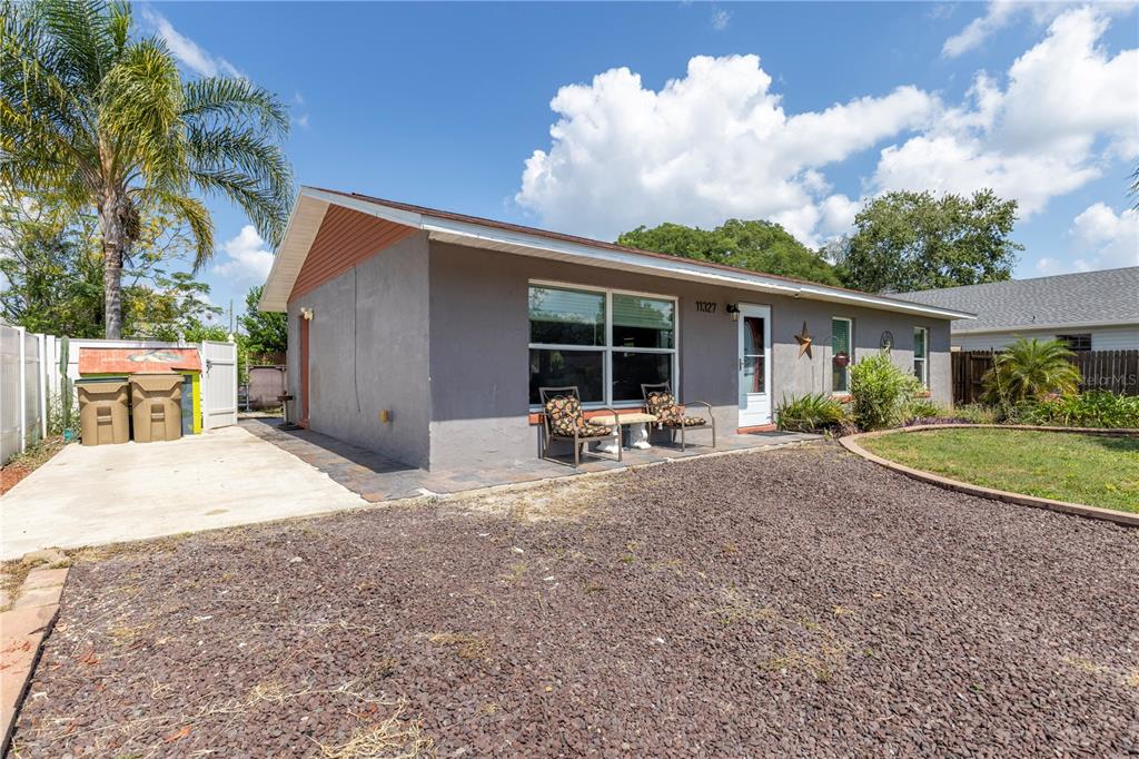 11327 Grove Street Leesburg, FL 34788 - Photo 3 of 40 a view of a backyard with plants and a patio