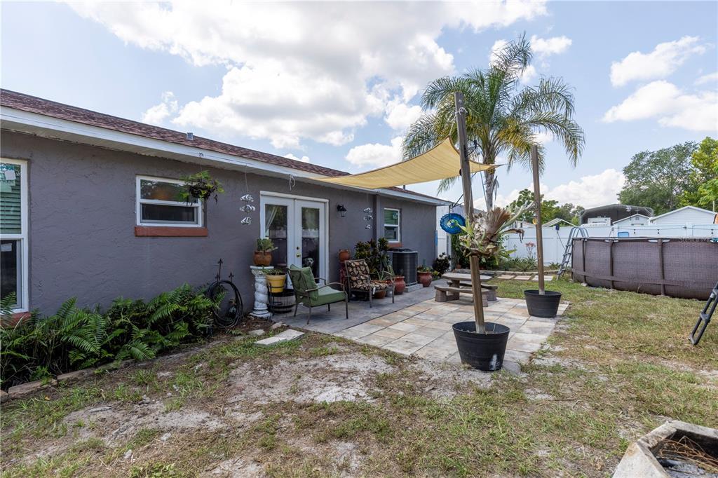 11327 Grove Street Leesburg, FL 34788 - Photo 33 of 40 a view of a house with patio and sitting area