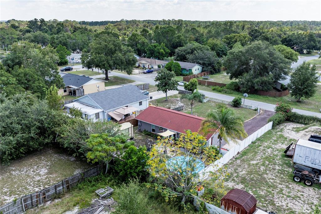 11327 Grove Street Leesburg, FL 34788 - Photo 36 of 40 an aerial view of a house with yard and outdoor seating