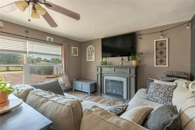 a kitchen with stainless steel appliances granite countertop a sink dishwasher stove and refrigerator with wooden floor