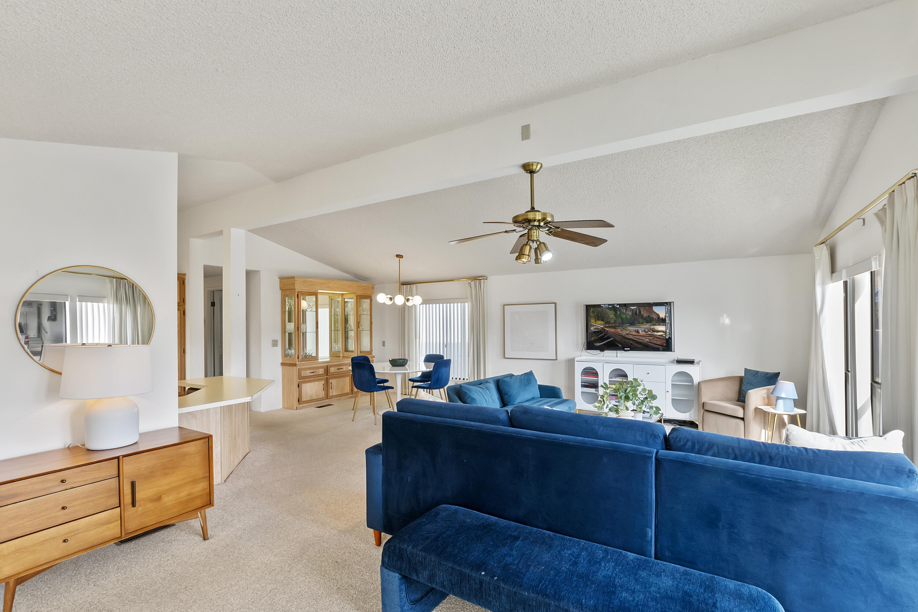 74711 Dillon Road, Unit 545 Desert Hot Springs, CA 92241 - Photo 9 of 42 a living room with furniture fireplace and flat screen tv