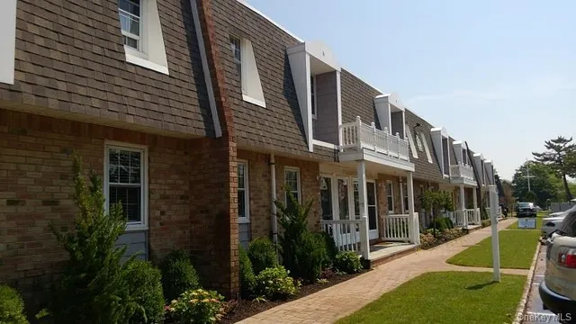 a kitchen with stainless steel appliances granite countertop a refrigerator stove top oven and sink