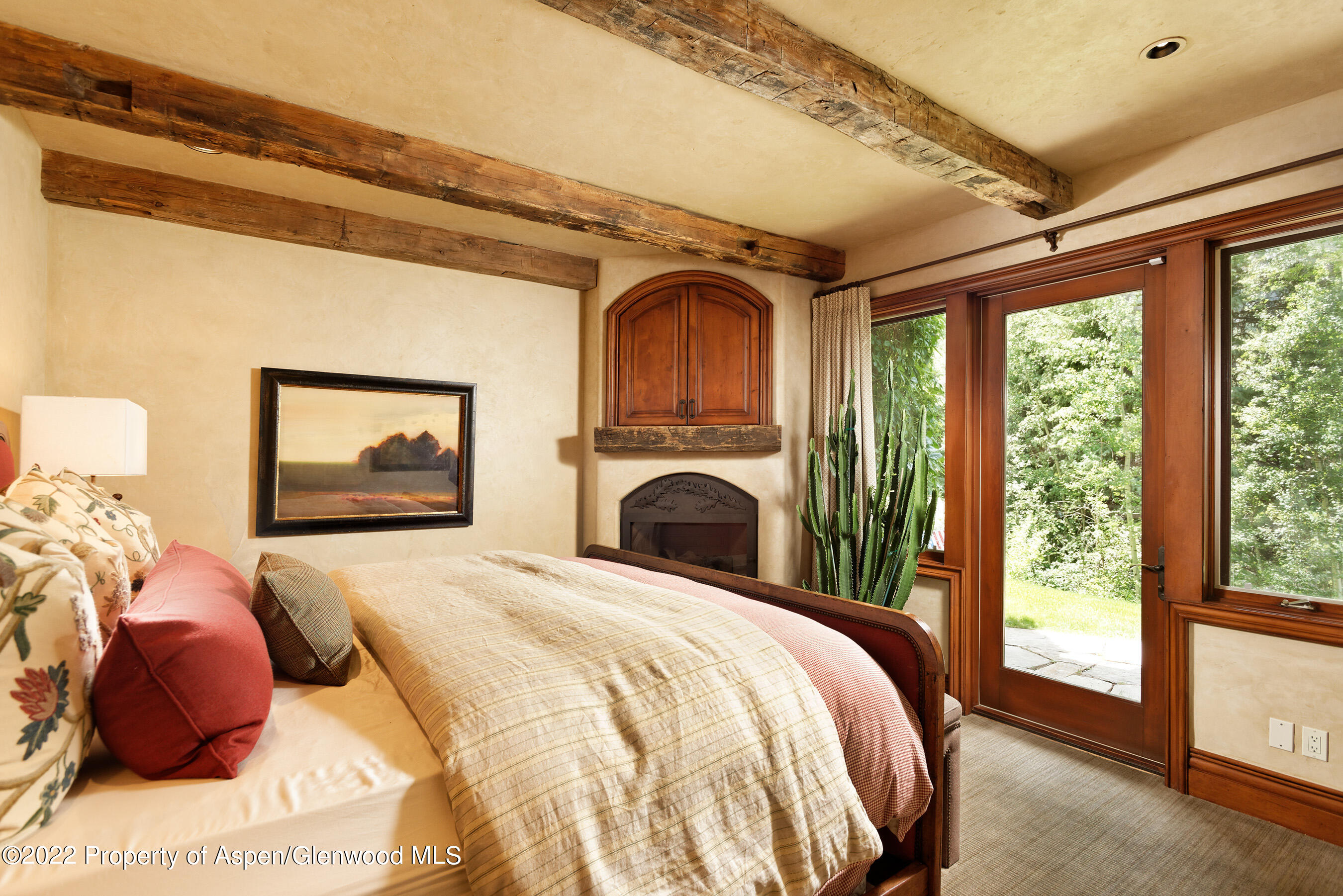 1225 Riverside Drive Aspen, CO 81611 - Photo 16 of 21 a bedroom with a bed and a large window